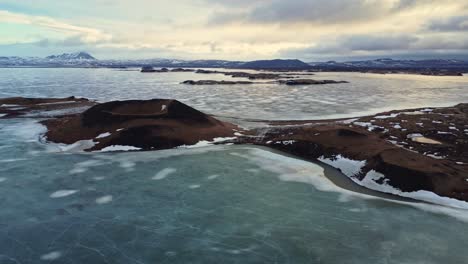 volcanic craters near frozen lake