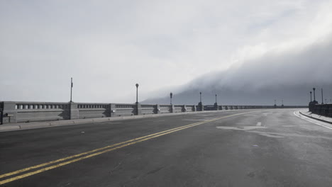 old empty stone bridge on a foggy day