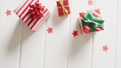 video of christmas gifts with christmas decoration and copy space on white background