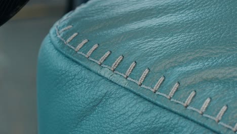 heat gun gently cures paint on sofa corner, sealing scratch in tight closeup