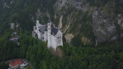 neuschwanstein castle with mountains in background, bavaria in germany