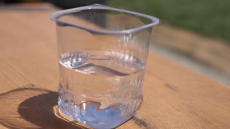 glass of water on a wooden table