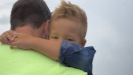 father walks and keeps in arms his little son