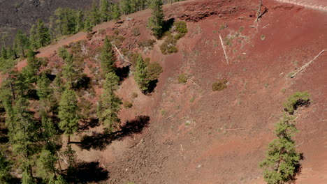 aerial shot from inside a cinder cone to dried lava fields