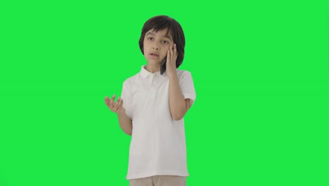 Indian-boy-talking-on-call-Green-screen