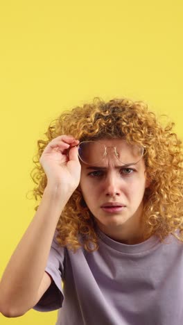 woman struggles to see with blurry vision or poor eyesight