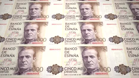 banknotes of five thousand spanish pesetas of the bank of spain rolling on screen, coins of the world, cash money, loop