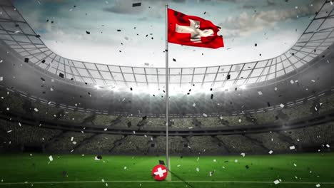 animation of confetti falling over flag of switzerland at sports stadium