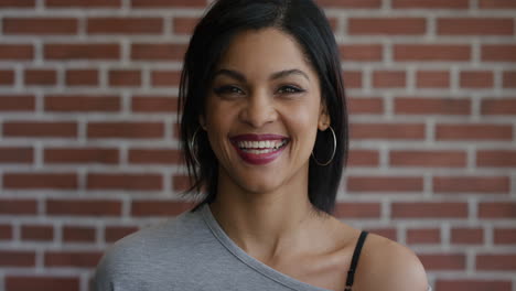 portrait-of-independent-young-hispanic-woman-laughing-cheerful-enjoying-successful-lifestyle-slow-motion-wearing-earings