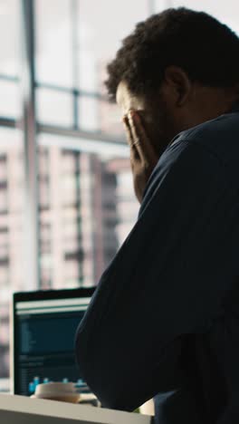 vertical video worker feeling painful headache while working, suffering burnout