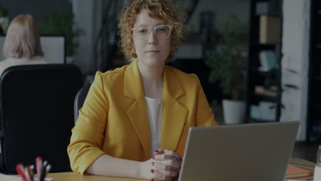 woman working on laptop in modern office