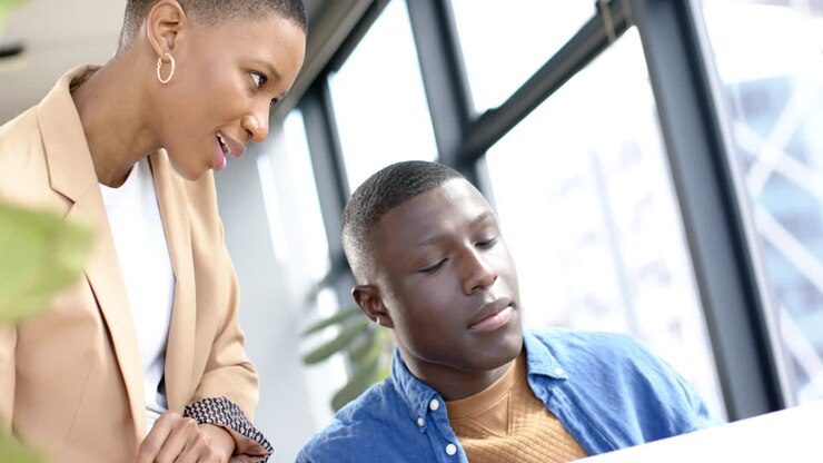 Diverse business people talking and working together in office, slow motion, copy space