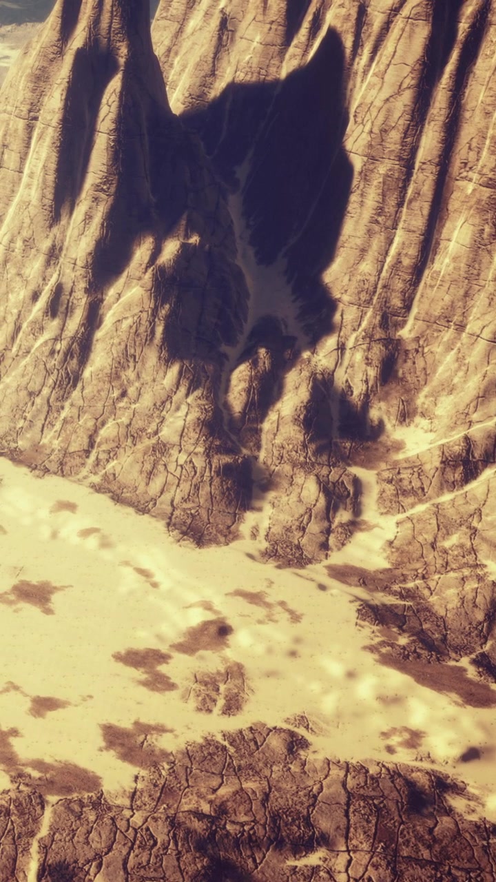 Rocky landscape with clear path and dry riverbed under bright sunlight