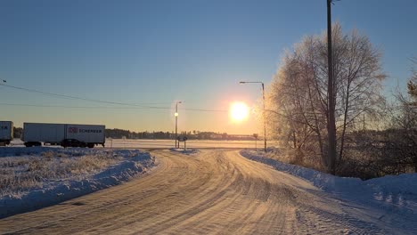 Cars-And-Trucks-Driving-in-snowy-and-sunny-winter-landscape-in-Europe,-4K