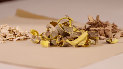 actual footage for an advertisement with the theme of traditional medicine, physician is selecting each dry medicinal herb to package the medicine according to the prescription