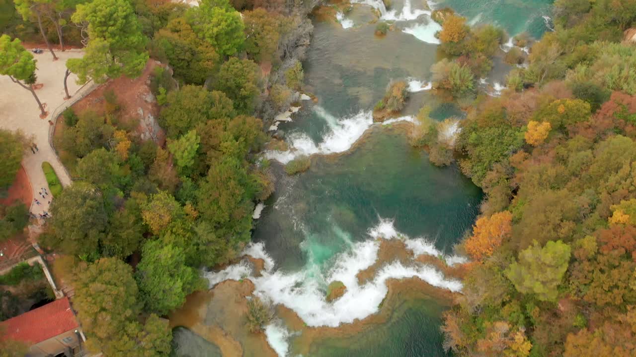 A drone captures the Krka waterfalls from a birds eye view, ultimately revealing the national park valley