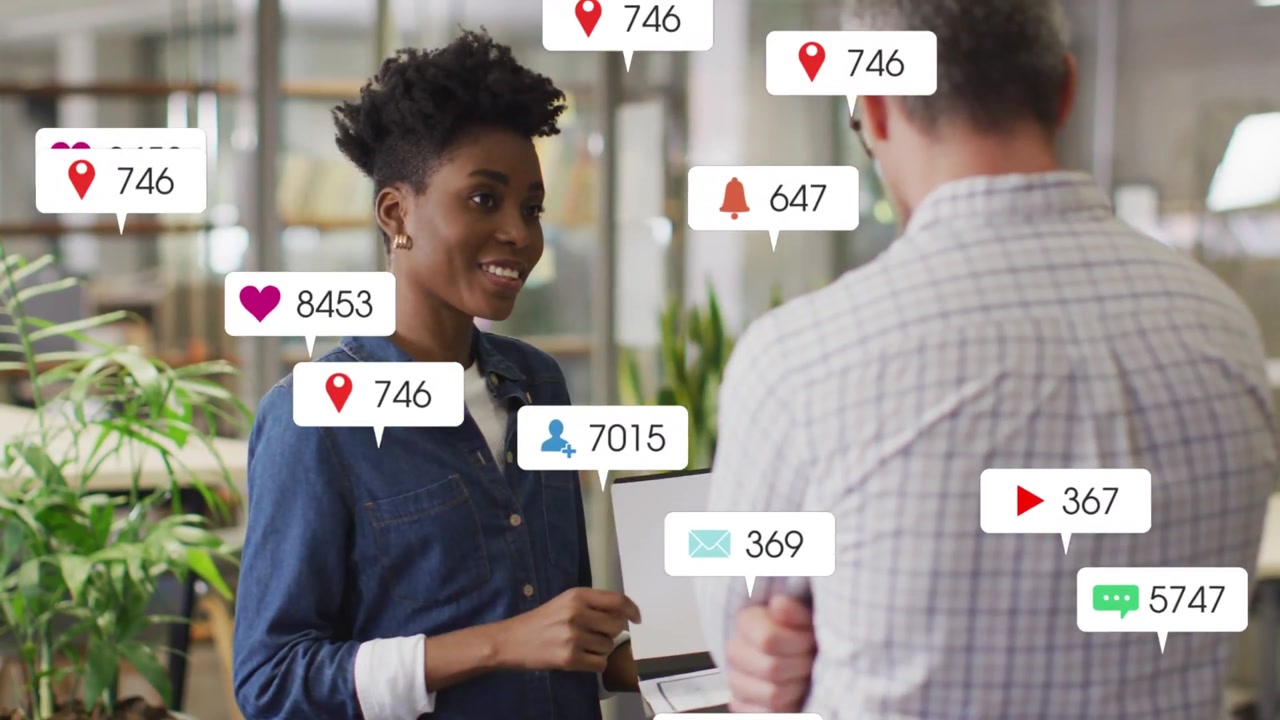 Vertical video: Tapping tablet, woman in denim at office causing social bubbles showing metrics