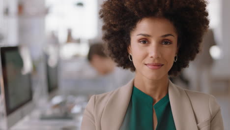 portrait mixed race business woman with afro looking confident entrepreneur enjoying successful startup company proud manager in office workspace