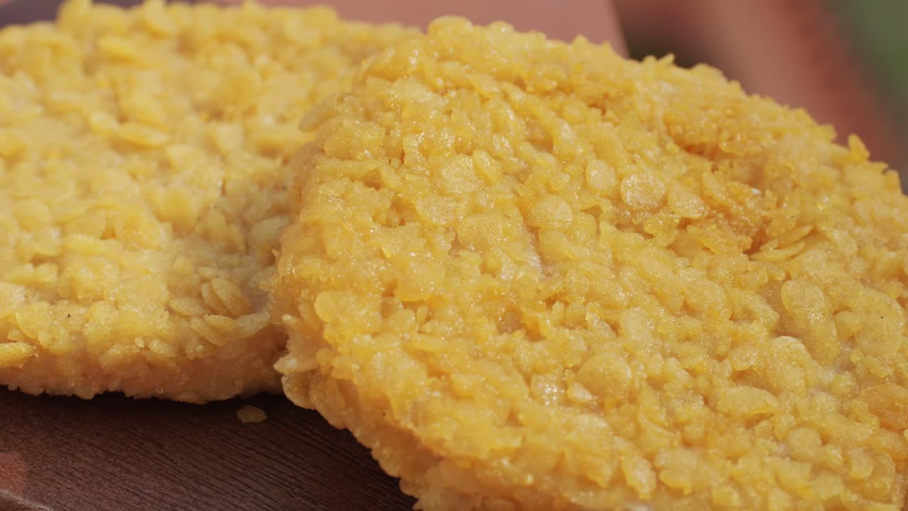 Delicious fresh crispy chicken nuggets on a dark concrete background. Unhealthy food, fast food. High quality 4k footage