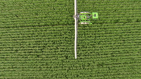 Sprayer-moving-through-corn-field,-applying-crop-protection