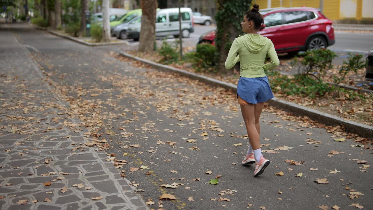 Woman Running in an Urban Park