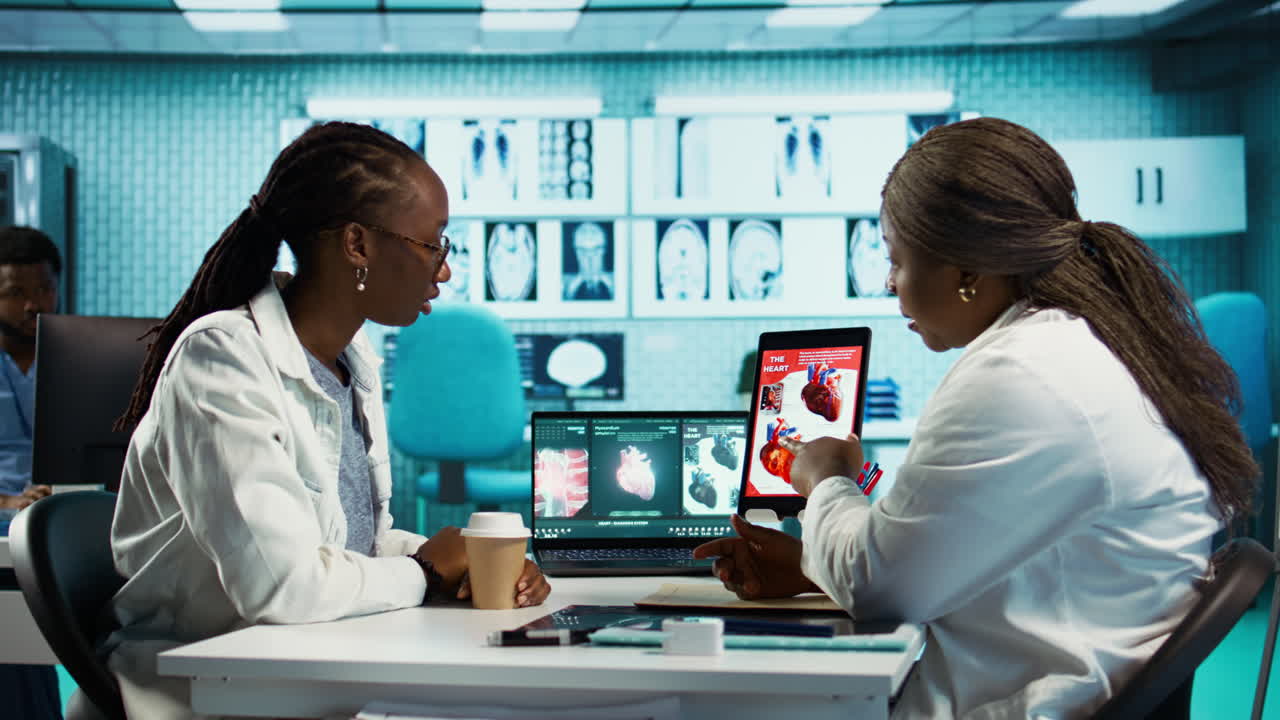 Medical office scene of a doctor and patient evaluating cardiology test results
