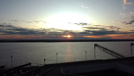 The-golden-hours,-mist-over-the-river-with-the-islands-in-the-background-and-the-pier-completing-a-beautiful-setting-in-spring