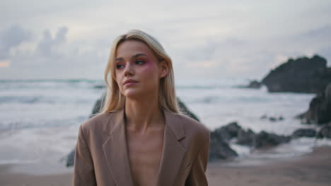 luxury girl walking shore in sexy suit closeup. beautiful ocean sunset on island