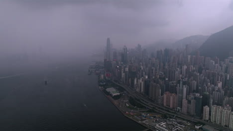Aerial-wide-shot-of-heavy-thunderstorm-and-lightning-strike-over-Hong-Kong-Island-during-cloudy-and-rainy-day