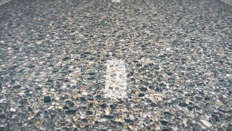 close-up view of road surface with white line