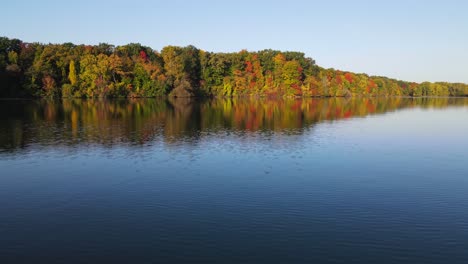 drone over lake in michigan in fall