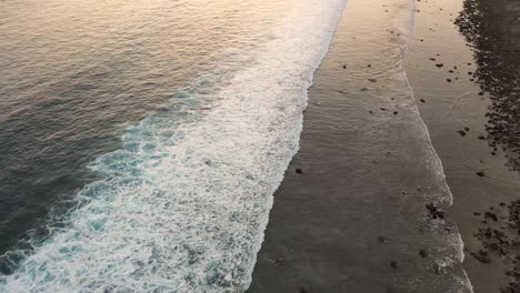 Aerial-view-of-Gili-Trawangan-Island-coastline,-Indonesia-with-sunset-sunlight