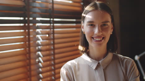 Portrait-of-Young-Happy-Businesswoman-in-Office