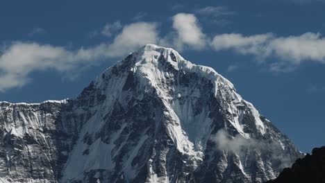 Sunny-Snowcapped-Mountains-Close-Up,-Climate-Change-of-Sun-Melting-Snow-on-Snowy-Himalayas-Mountains-Showing-Warming-Up-of-the-Planet-with-Sunshine-Shining-and-Blue-Sky-on-Sunny-Day