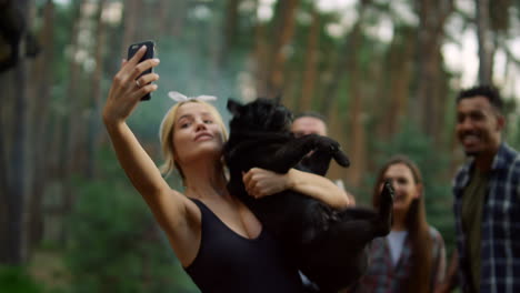 friendly people posing for photo outside. cheerful guys making selfie outdoors