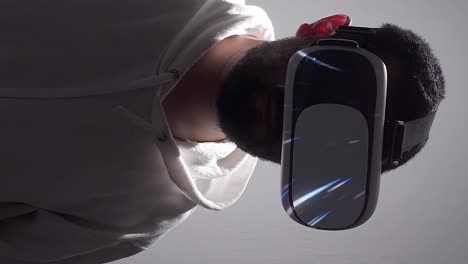 Man-wearing-VR-headset-with-colorful-streaks-of-light-flying-around