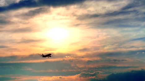 the plane flies against the background of the sunrise