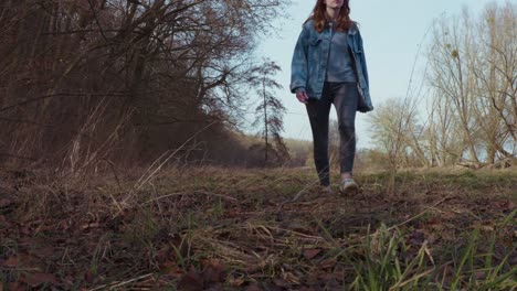 girl walking through a clearence in a forrest - slowmotion
