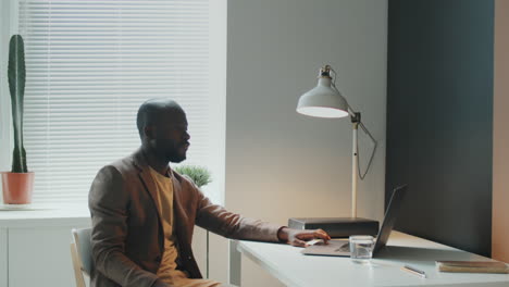 man using laptop in office