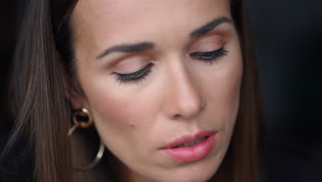 pensive businesswoman focusing on work. female worker looking down