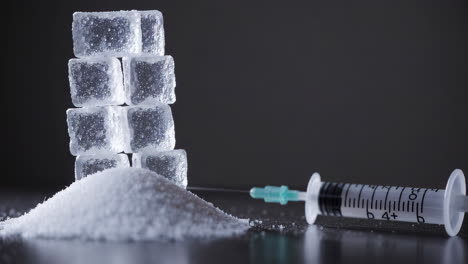 sugar, ice cubes, and syringe
