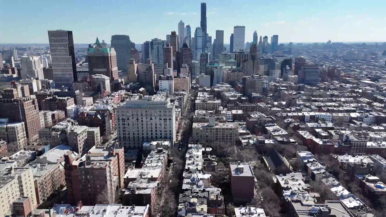 Horizontal drone panoramic shot over Remsen Street in Brooklyn, showcasing the city's expansive skyline, historic architecture, and vibrant urban atmosphere with a wide aerial perspective.