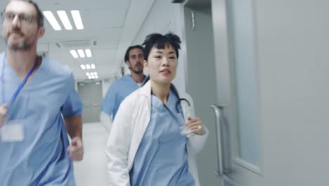 Doctors-running-through-a-hospital-corridor-4k