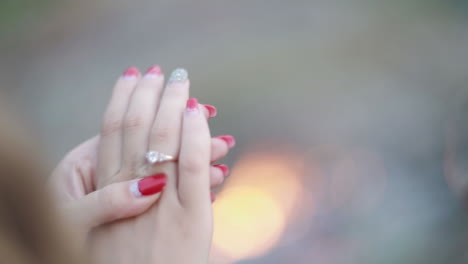 young woman wearing diamond ring on her finger