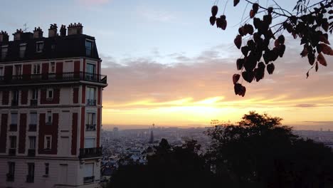 static time lapse of the sun rising up over paris, france