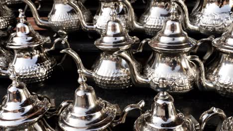 traditional moroccan teapots in a shop in the souk of the medina in marrakech, morocco.