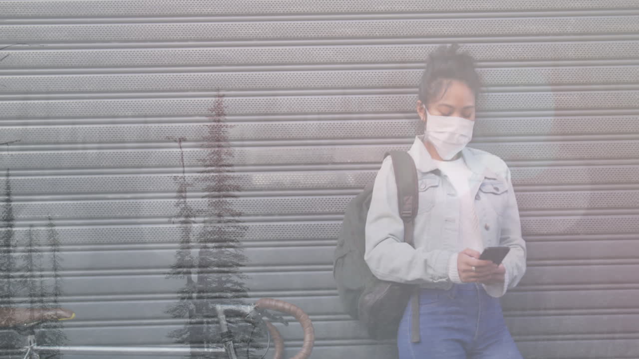 겨울 풍경과 함께 스마트 폰을 사용하여 얼굴 마스크를 착용 한 여성의 애니메이션