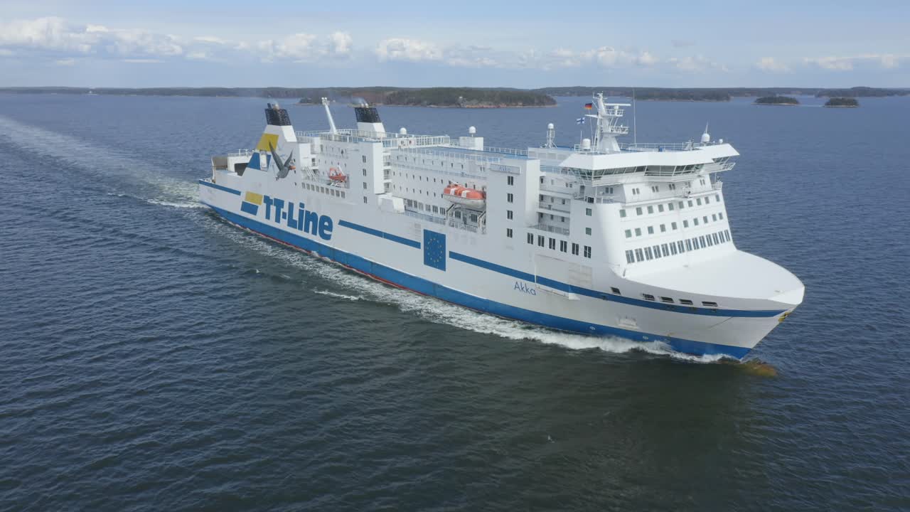 TT Line car ferry AKKA making way ahead in Finnish archipelago. Low altitude aerial front view.