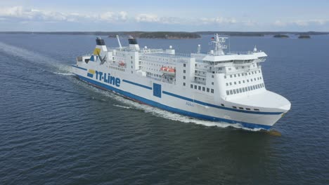 tt line car ferry akka making way ahead in finnish archipelago. low altitude aerial front view.