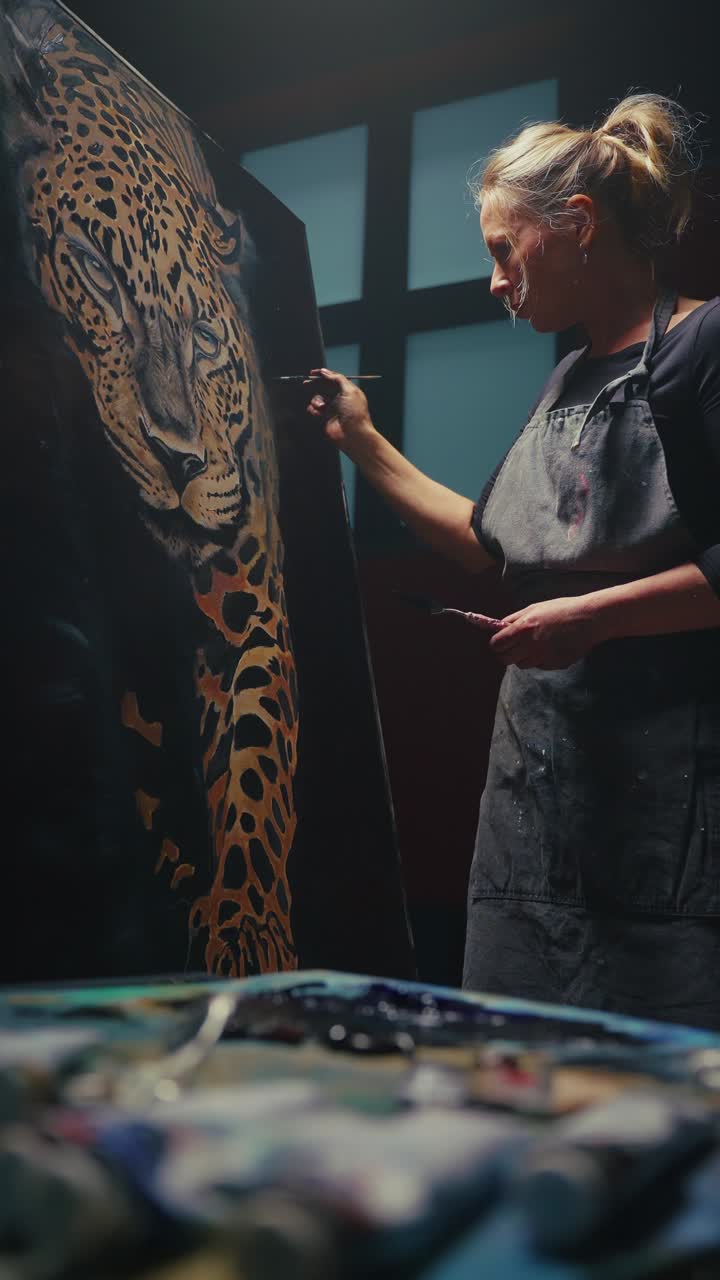 Woman Artist Painting a Leopard